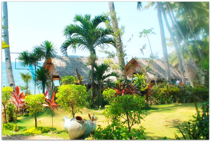 Native style cottages by the beach in Catmon at Recuerdo Beach Resort, Cebu Province.